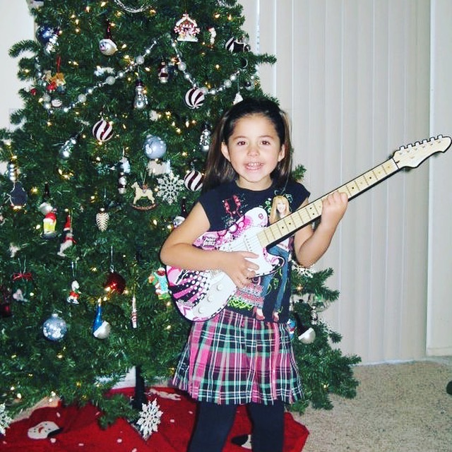 Young Ava with guitar